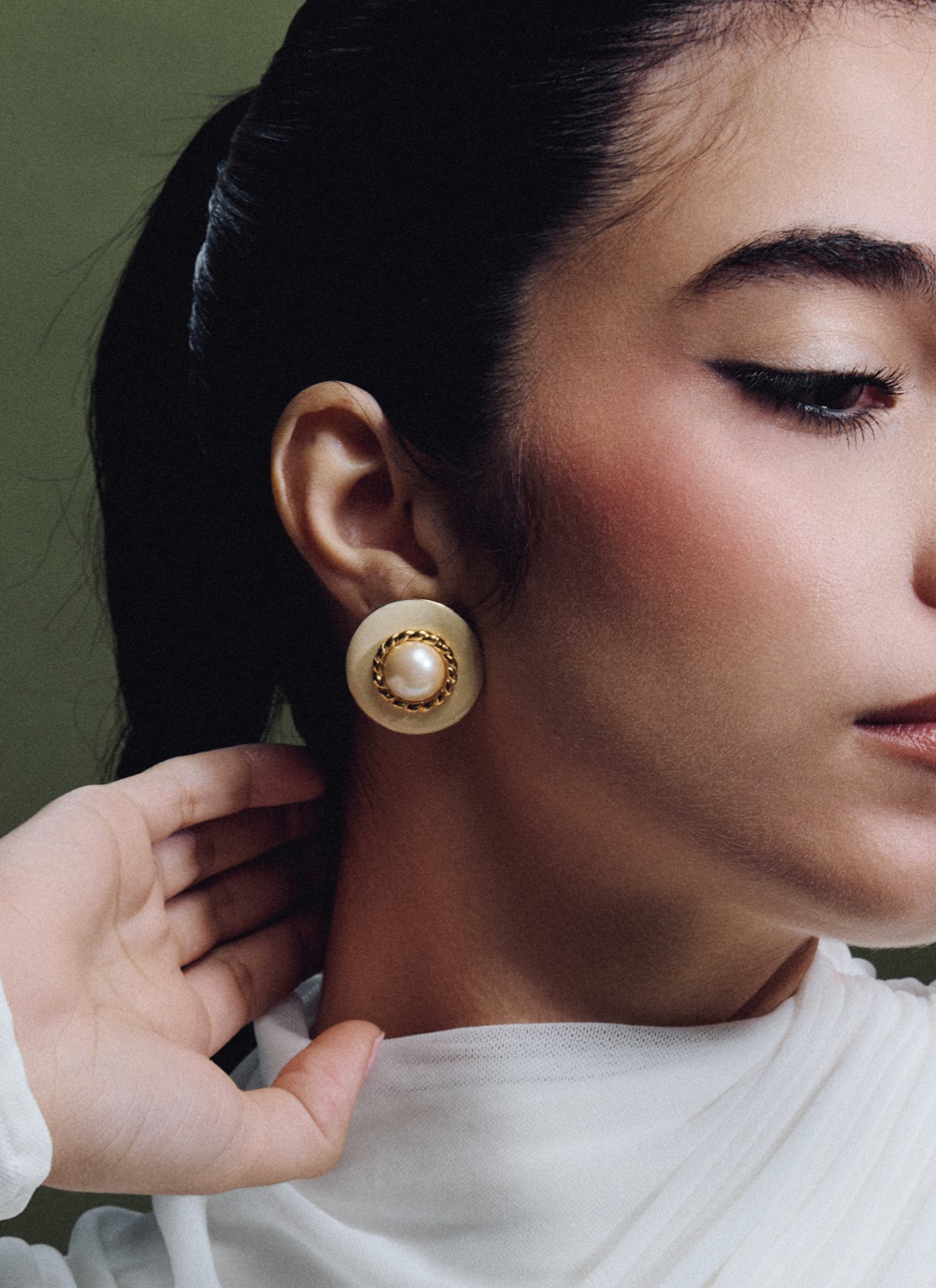 white and gold earrings